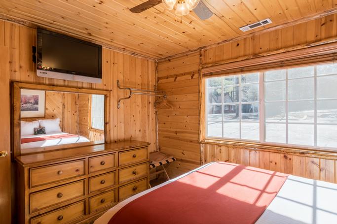 Big Bear Frontier | Big Bear Lake, California | bed and dresser in cabin
