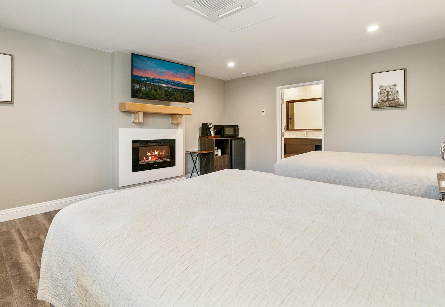 Big Bear Frontier | Big Bear Lake, California | two beds facing fireplace