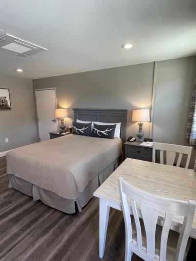 Big Bear Frontier | Big Bear Lake, California | bed next to table