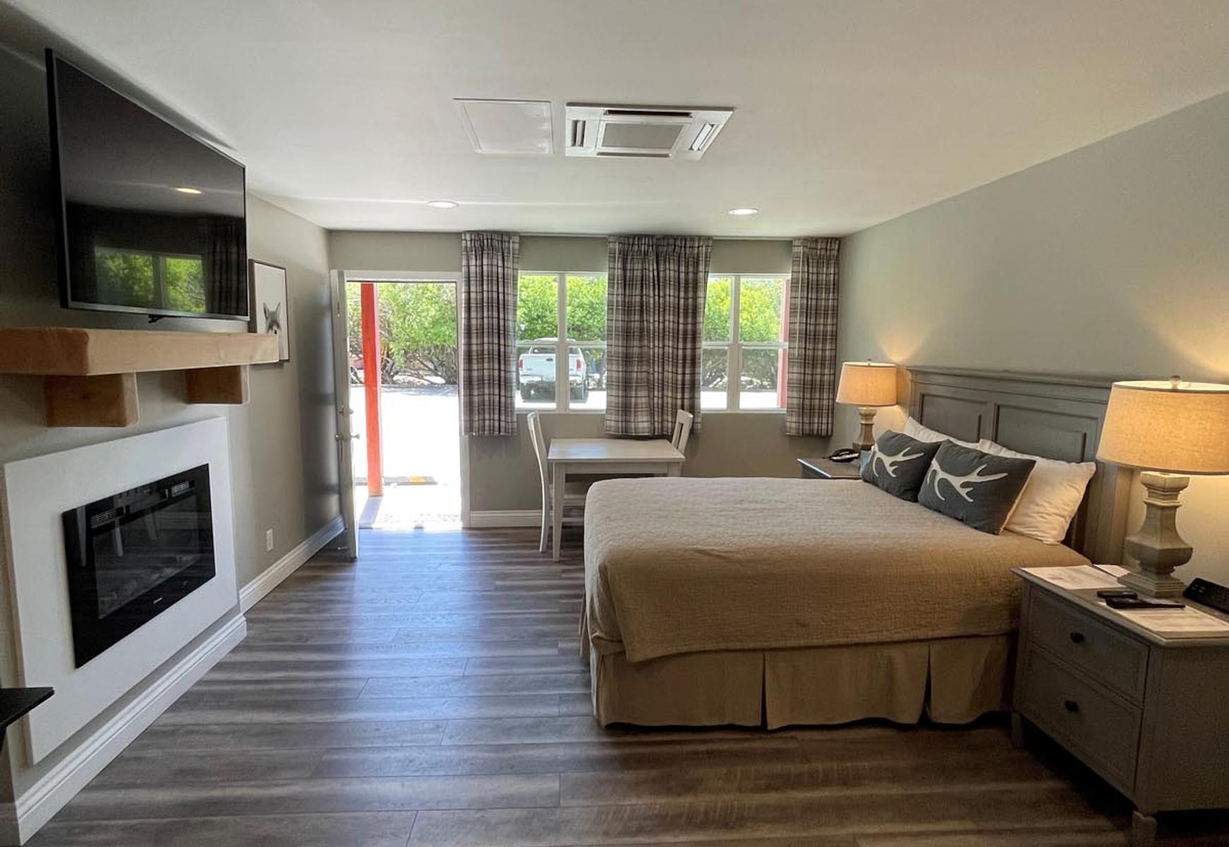 Big Bear Frontier | Big Bear Lake, California | Bedroom, table and tv